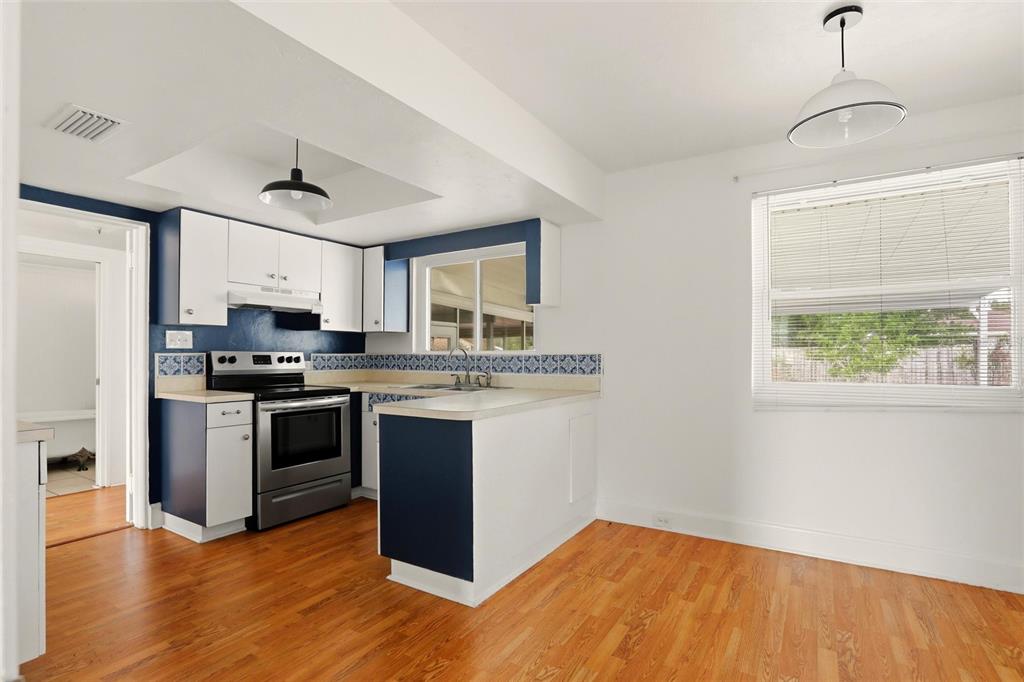 404 West Whidden Street Arcadia, FL 34266 - Photo 8 of 34 a kitchen with stainless steel appliances granite countertop a stove a sink and a refrigerator