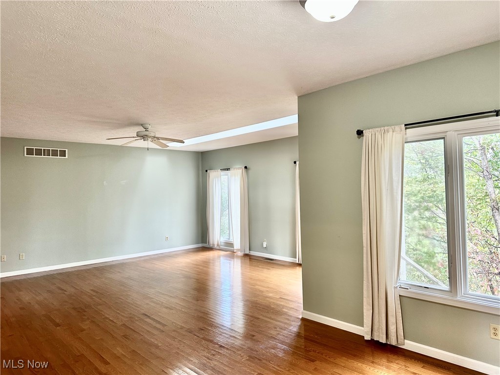 6047 Tallmadge Road Rootstown, OH 44272 - Photo 21 of 50 Dining room adjoins living room Loads of windows
