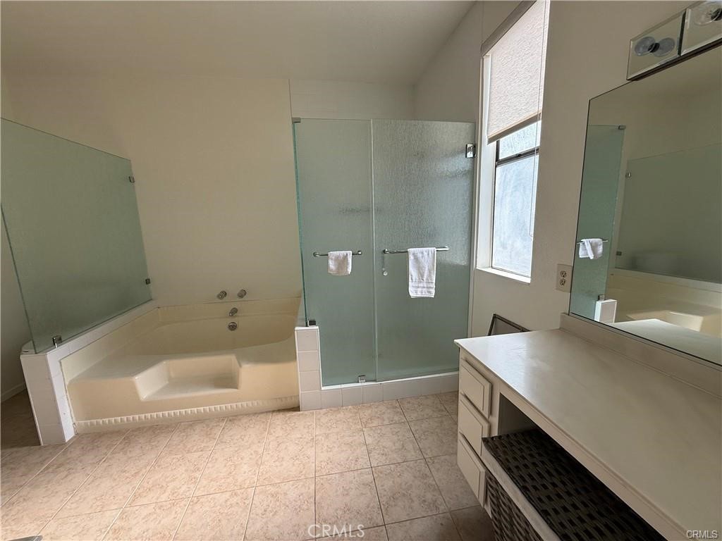415 West Duarte Road Arcadia, CA 91007 - Photo 11 of 14 a bathroom with a tub a sink and mirror