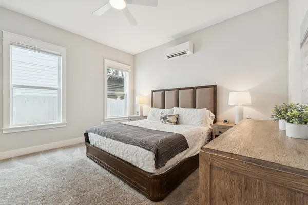 a bed room with bed and window