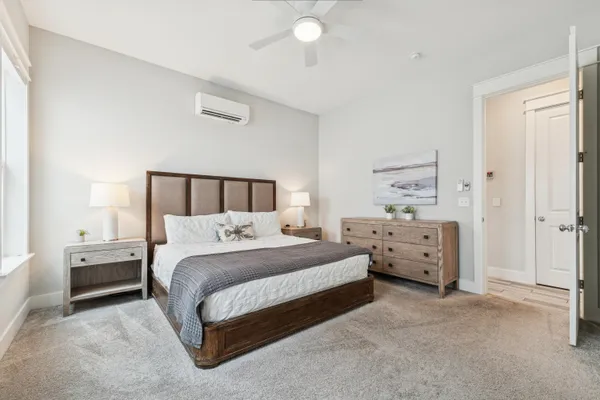 a bedroom with a bed and a mirror