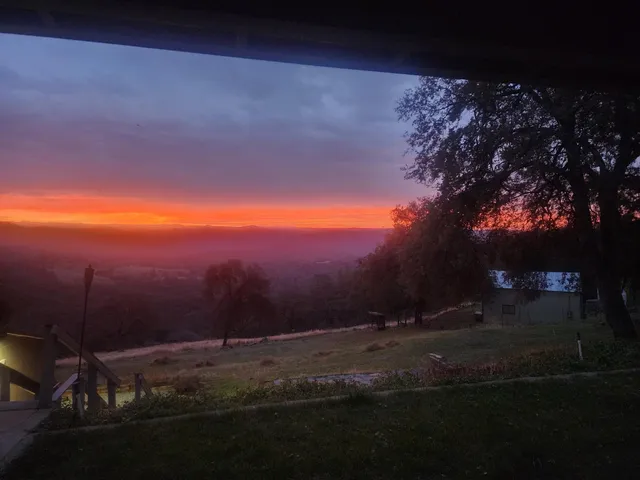 a view of yard with ocean and mountain