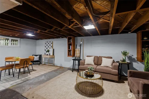 a living room with furniture a ceiling fan and a rug