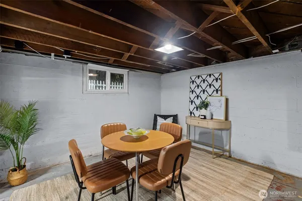 a dining room with furniture and wooden floor