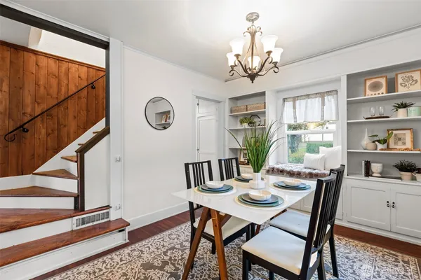 a view of a dining room with furniture window and wooden floor