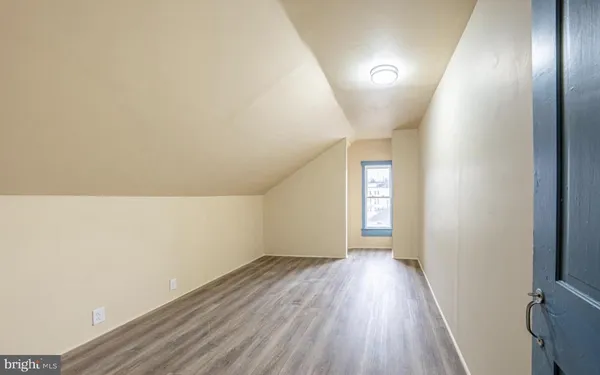 a view of hallway with wooden floor