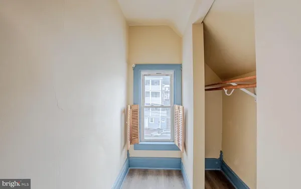 a view of front door with wooden floor