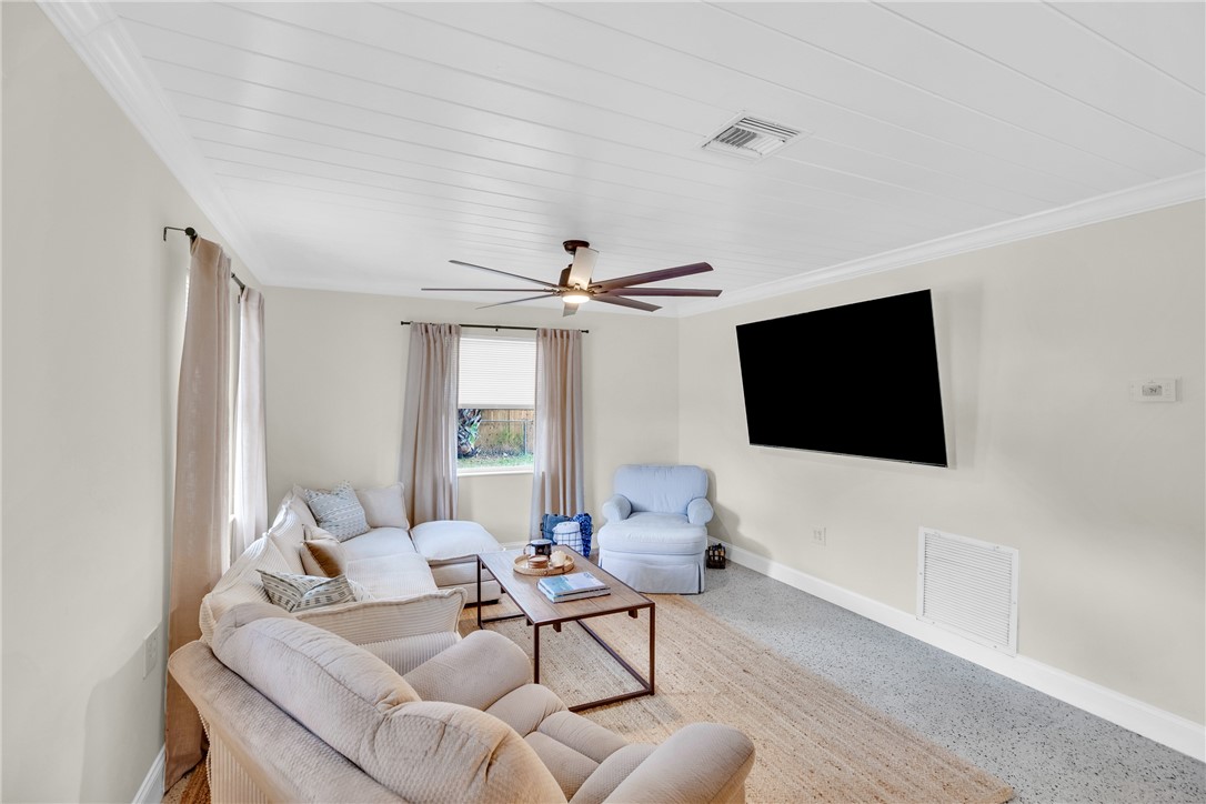 3655 2nd Place Vero Beach, FL 32968 - Photo 5 of 27 a living room with furniture and a flat screen tv