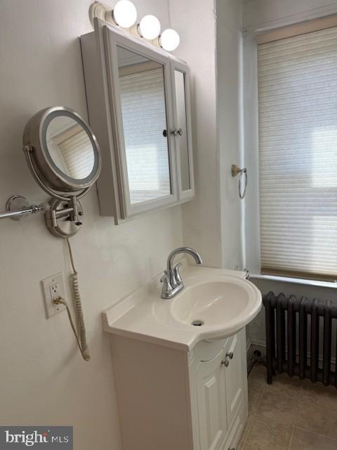 15 Brewer Avenue, Unit B Annapolis, MD 21401 - Photo 18 of 26 a bathroom with a sink a toilet and a mirror