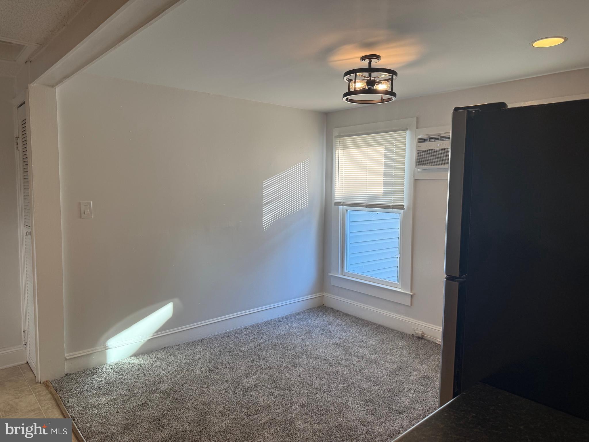 15 Brewer Avenue, Unit B Annapolis, MD 21401 - Photo 26 of 26 an empty room with windows and cabinet