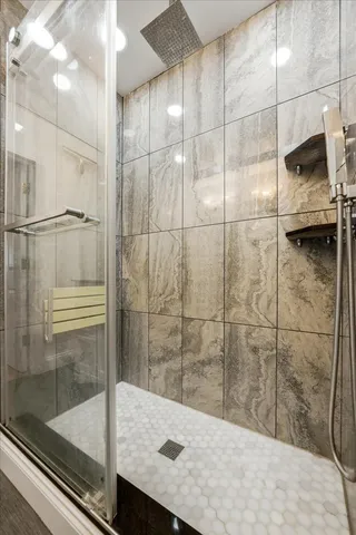 a bathroom with a shower and a sink