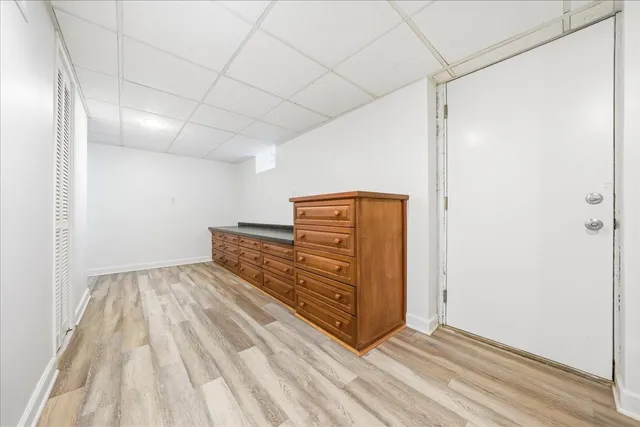 a view of room with stairs and wooden floor