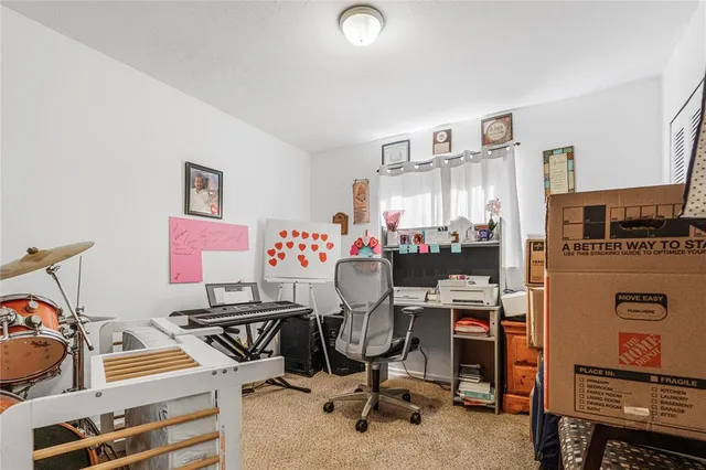 a view of a workspace with furniture