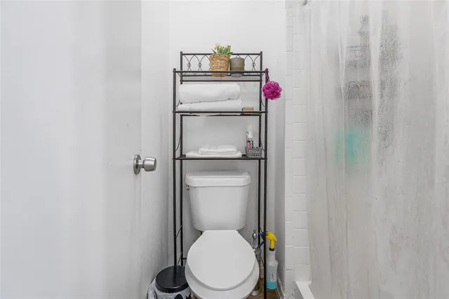 a bathroom with a toilet and a sink