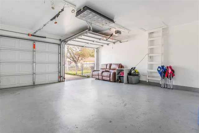 a view of a big room with air conditioner duct and materials on floor