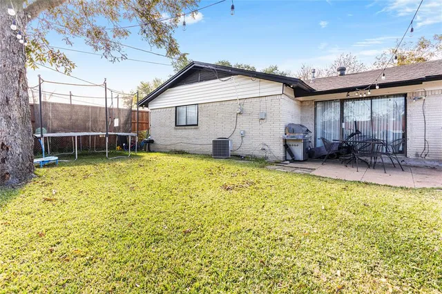 a view of a house with swimming pool and sitting area