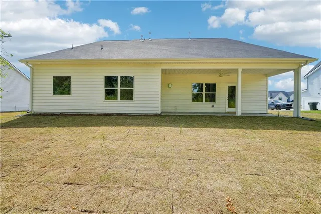 a view of a backyard of the house