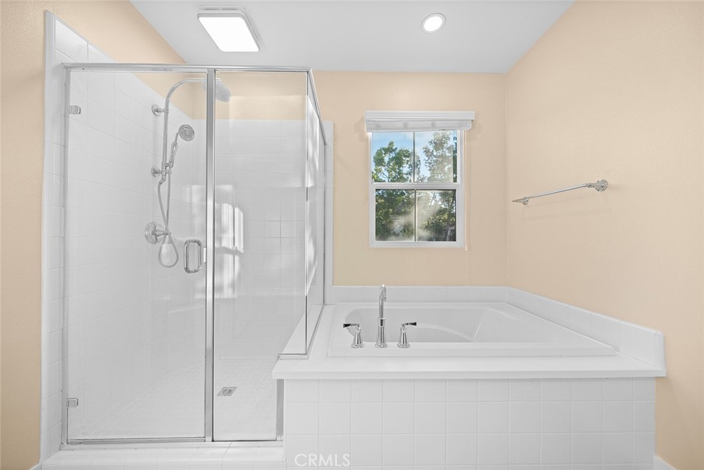 143 Rodeo Irvine, CA 92602 - Photo 23 of 37 a bathroom with a bathtub and a shower