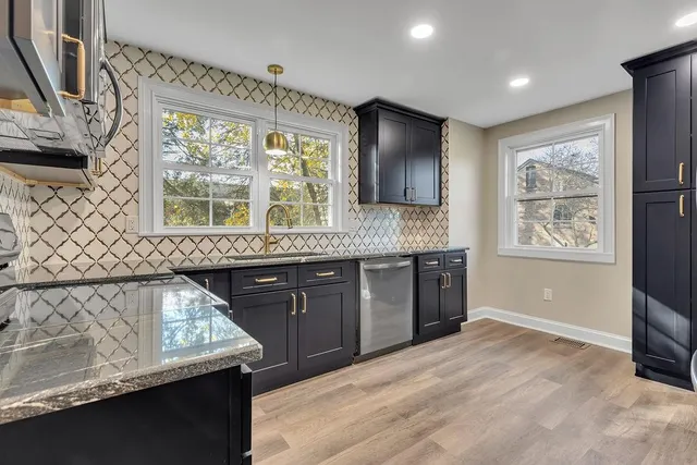 a kitchen with a sink and a window