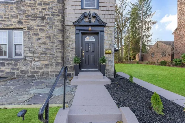 a front view of a house with garden