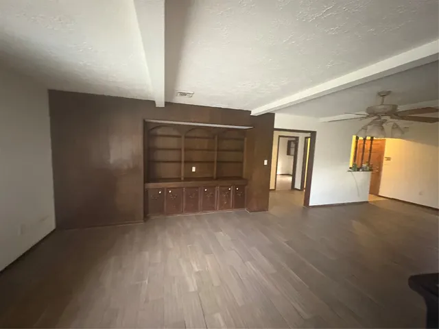 a view of a livingroom with wooden floor