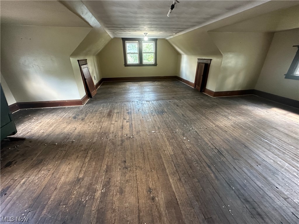 10820 Bellaire Road Cleveland, OH 44111 - Photo 19 of 24 Bonus room with vaulted ceiling and dark hardwood floors