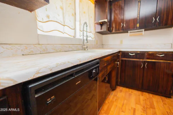 a kitchen with a sink and cabinets