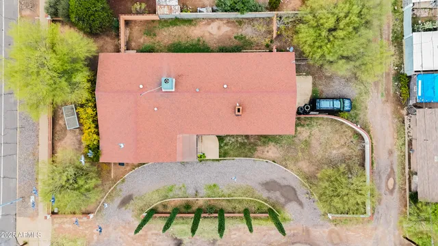 an aerial view of a house with a swimming pool