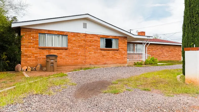 a front view of a house with yard