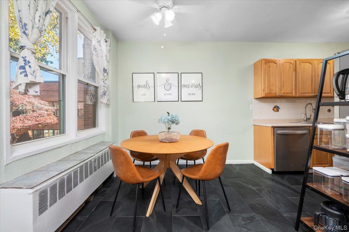 953 West Boston Post Road, Unit 3G Mamaroneck, NY 10543 - Photo 11 of 23 a view of a dining room with furniture window and wooden floor