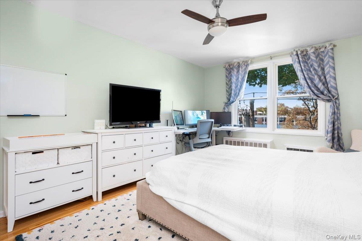 953 West Boston Post Road, Unit 3G Mamaroneck, NY 10543 - Photo 14 of 23 a bedroom with a bed and a flat screen tv