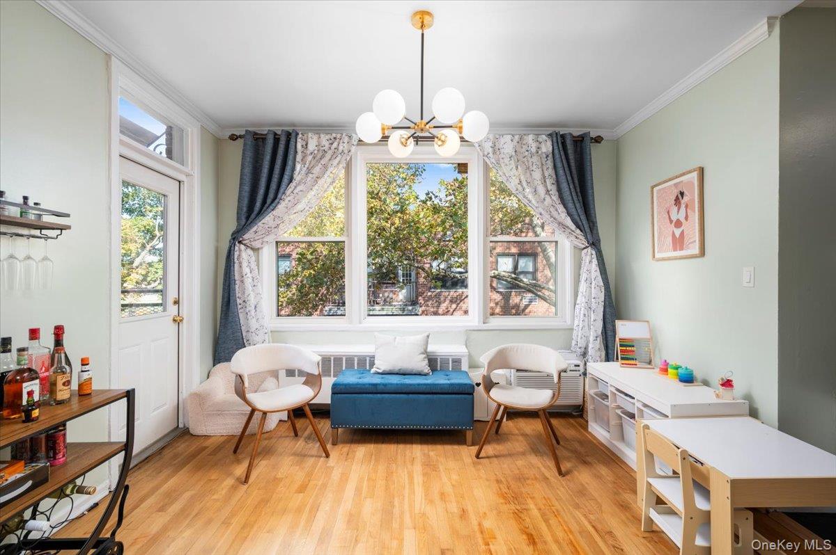 953 West Boston Post Road, Unit 3G Mamaroneck, NY 10543 - Photo 7 of 23 a living room with furniture and a large window