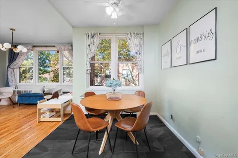 a dining room with furniture and window
