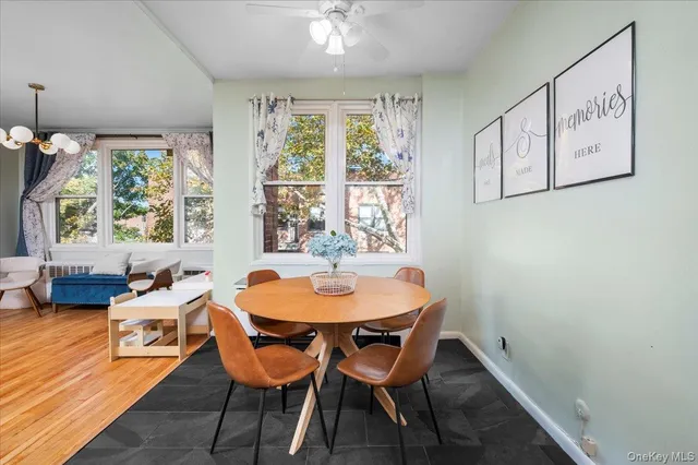 a dining room with furniture and window