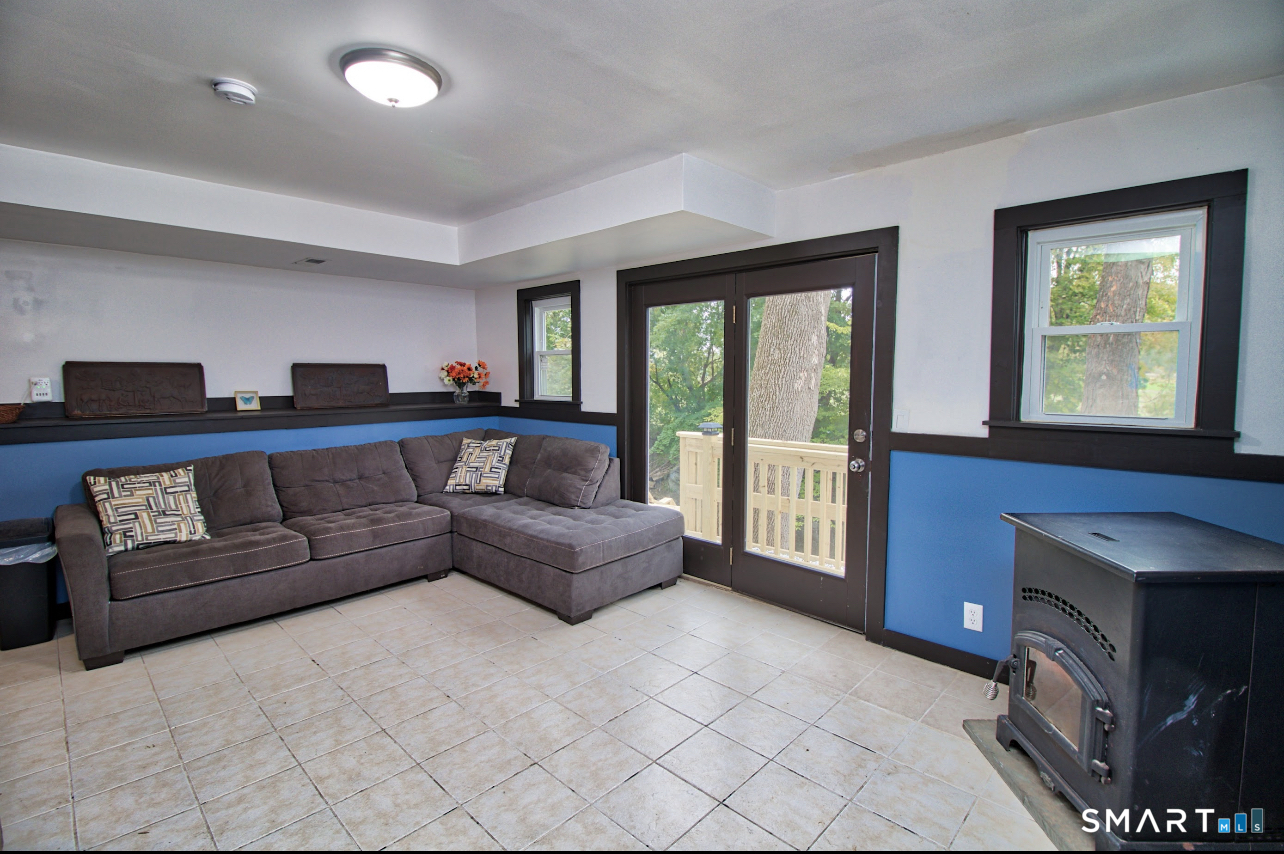 15 Lower Road North Canaan, CT 06018 - Photo 26 of 36 a living room with a couch and a large window