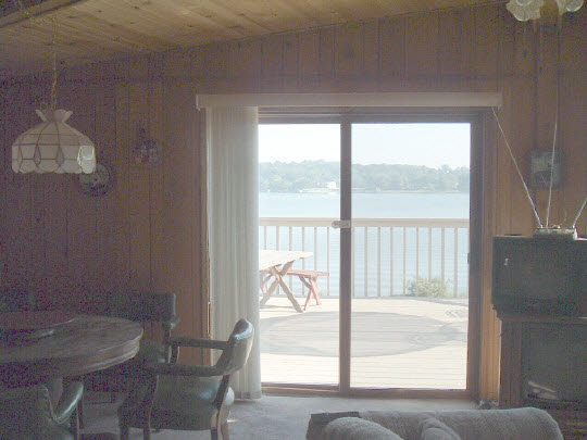 1906 Baintree Road Lake Summerset, IL 61019 - Photo 4 of 6 a view of a room that has a bed and a table in it