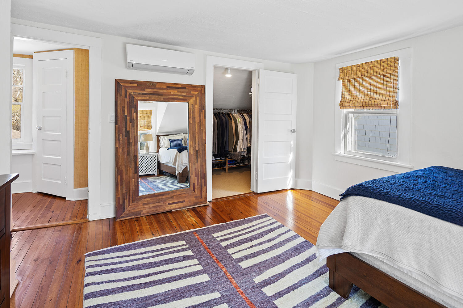 33 Old Farm Road Darien, CT 06820 - Photo 19 of 28 a bedroom with a bed and wooden floor