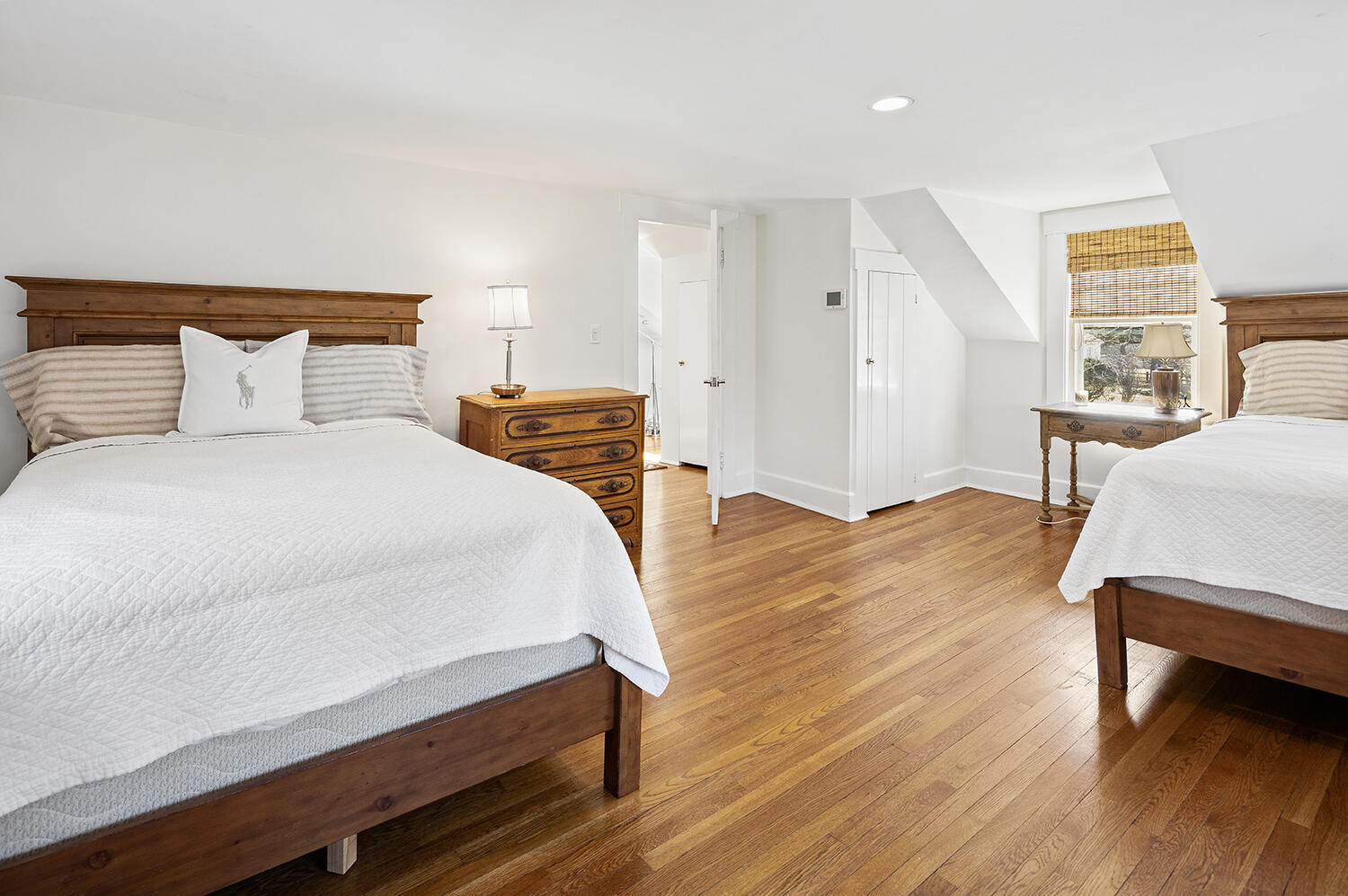 33 Old Farm Road Darien, CT 06820 - Photo 24 of 28 a bedroom with a bed and wooden floor
