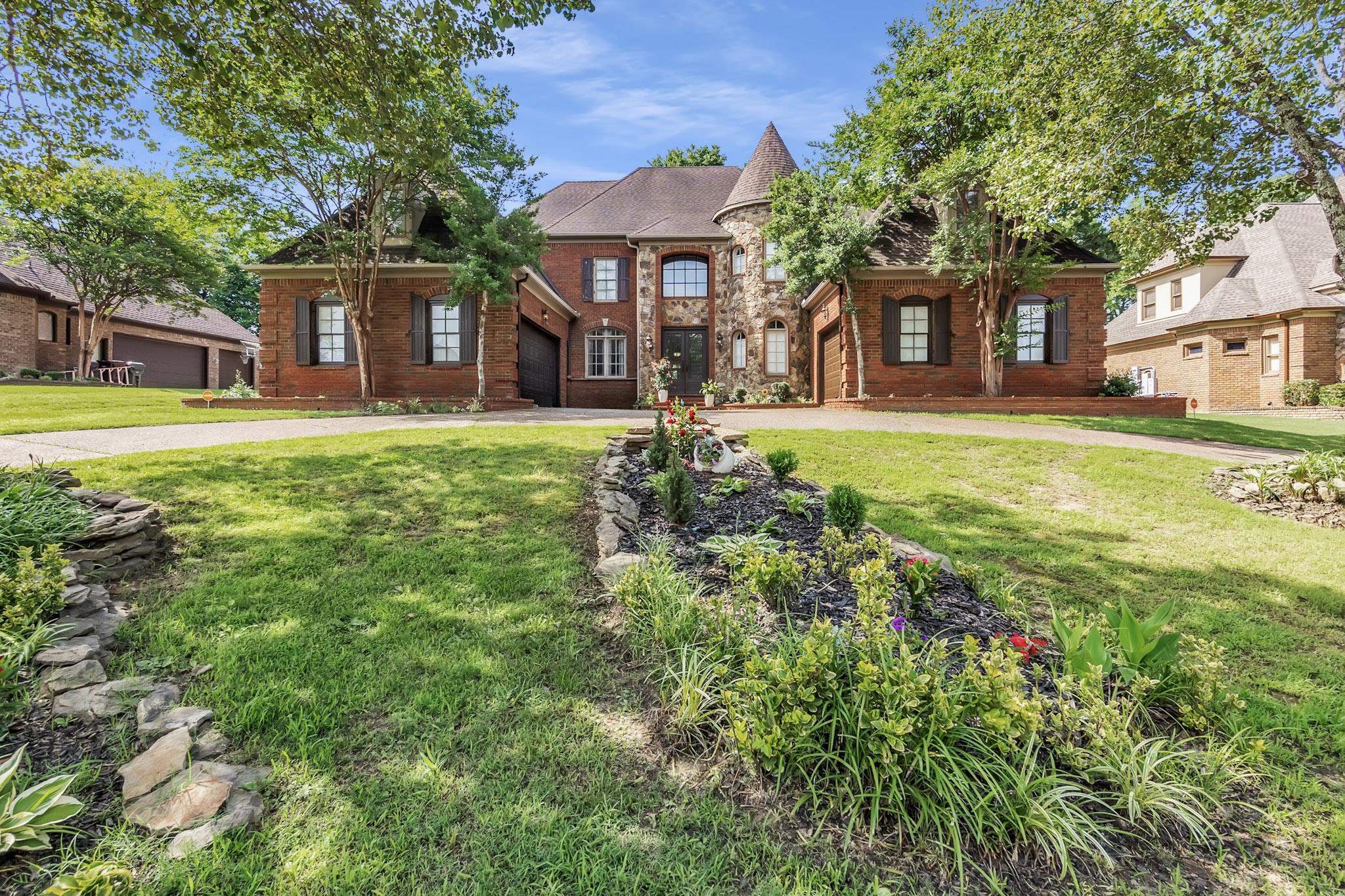 649 Ridge Springs Road Collierville, TN 38017 - Photo 3 of 38 a view of a house with a big yard and large trees