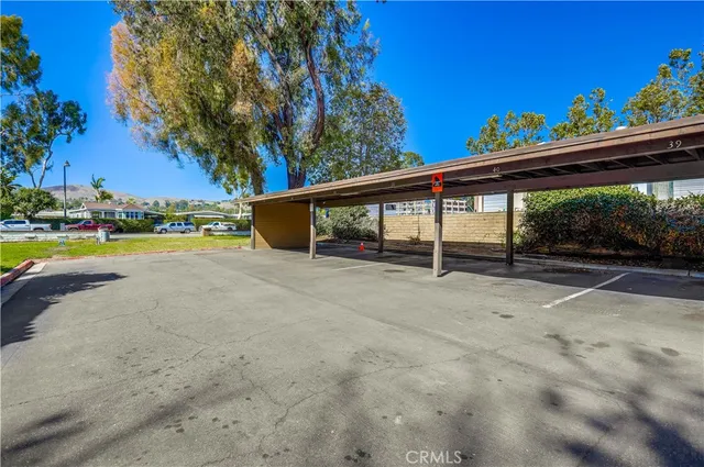 a view of a swimming pool with an outdoor space and seating area