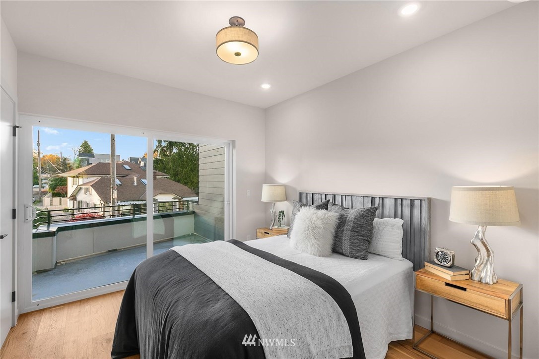 5200 Renton Avenue South Seattle, WA 98118 - Photo 13 of 21 a bedroom with a bed and a large window