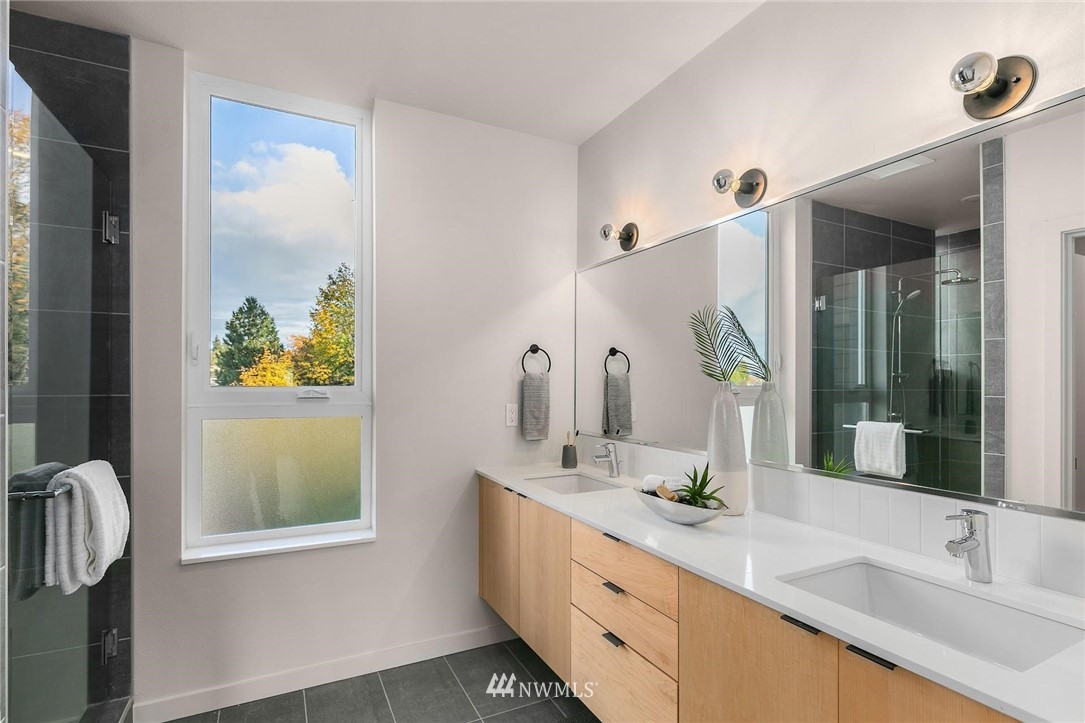 5200 Renton Avenue South Seattle, WA 98118 - Photo 14 of 21 a bathroom with a double vanity sink and a mirror