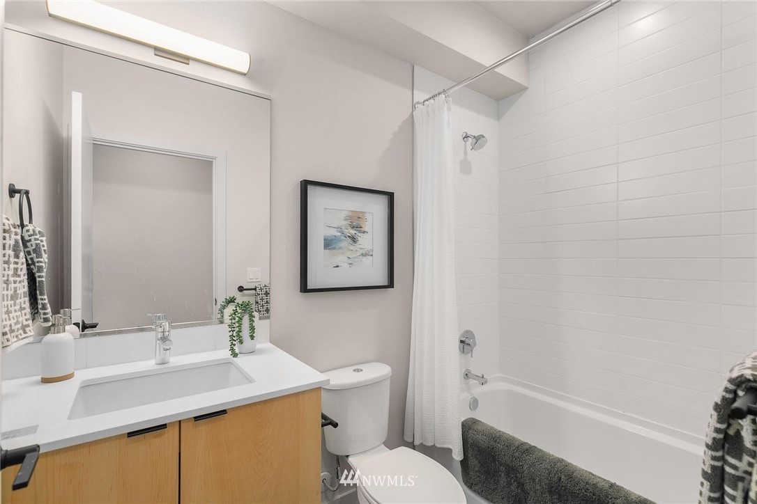 5200 Renton Avenue South Seattle, WA 98118 - Photo 17 of 21 a bathroom with a sink toilet and shower