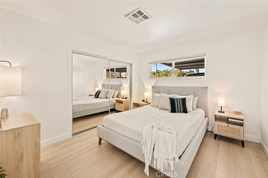 80890 Highway 111 Indio, CA 92201 - Photo 15 of 39 a bedroom with a bed and a couch