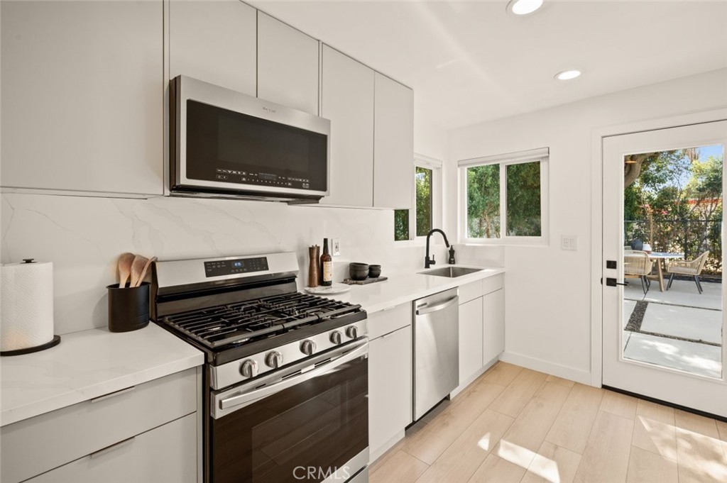 80890 Highway 111 Indio, CA 92201 - Photo 25 of 39 a kitchen with a stove and a microwave