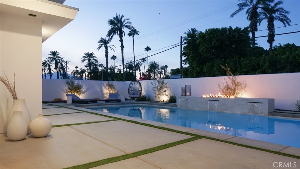 80890 Highway 111 Indio, CA 92201 - Photo 37 of 39 a view of swimming pool with a table and chairs