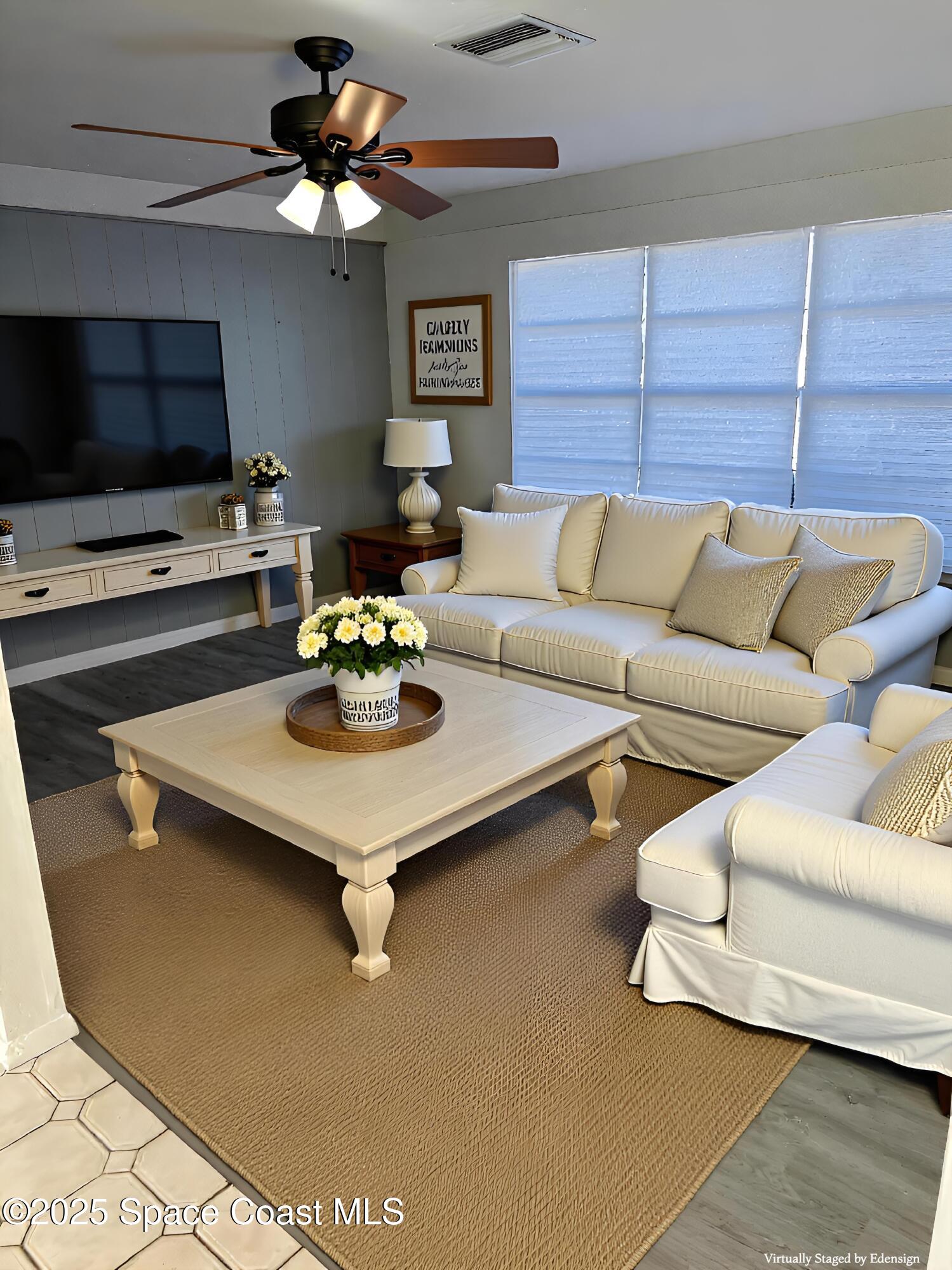 2361 Colony Drive Melbourne, FL 32935 - Photo 10 of 40 a living room with furniture and a flat screen tv