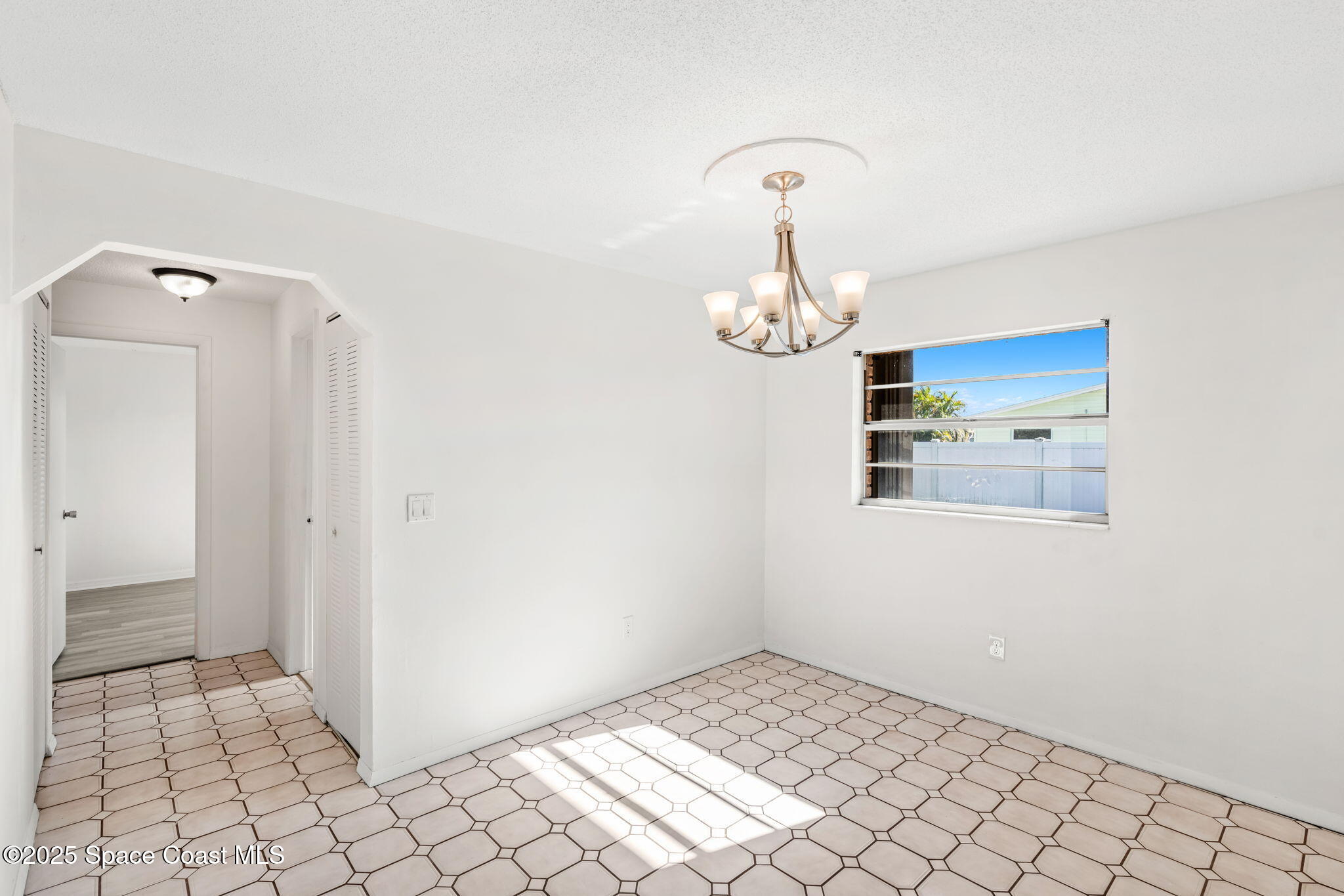 2361 Colony Drive Melbourne, FL 32935 - Photo 12 of 40 a view of an empty room and wooden floor