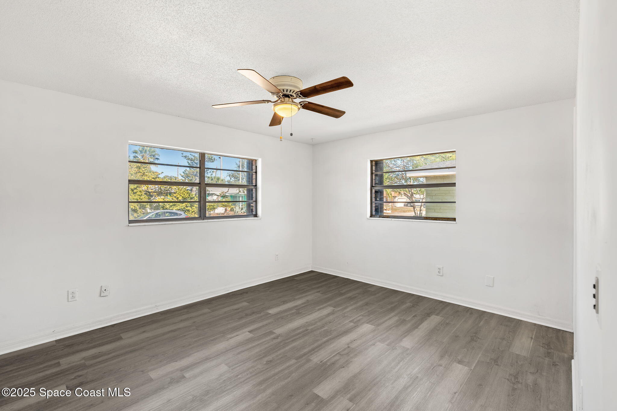 2361 Colony Drive Melbourne, FL 32935 - Photo 14 of 40 a view of empty room with wooden floor