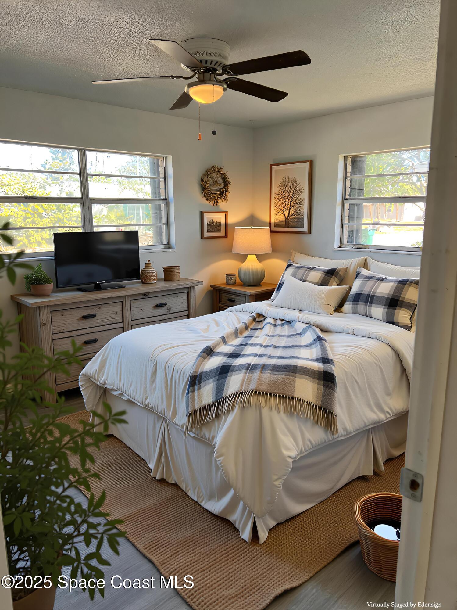 2361 Colony Drive Melbourne, FL 32935 - Photo 16 of 40 a bed sitting in a bedroom next to a window